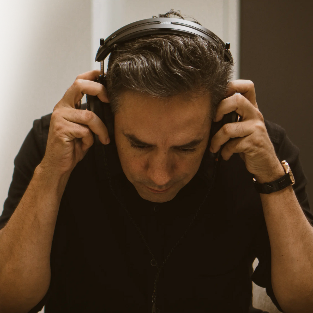 Audeze MM-500 studio headphones with over-ear design, black ear cups, and adjustable headband for professional audio monitoring.