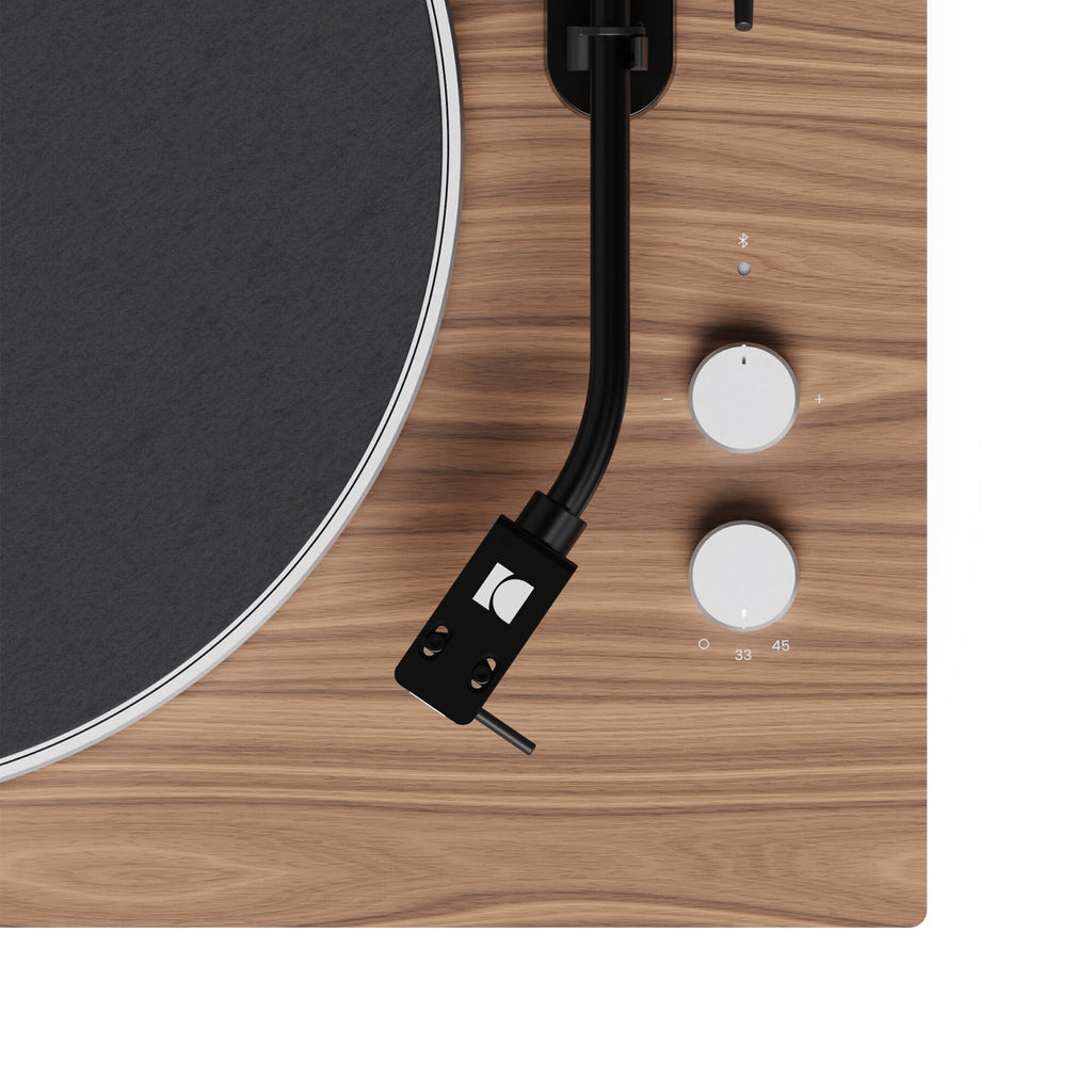 Kanto Audio OBI3 Gen 2 turntable, Walnut, close-up of tonearm and start/speed buttons